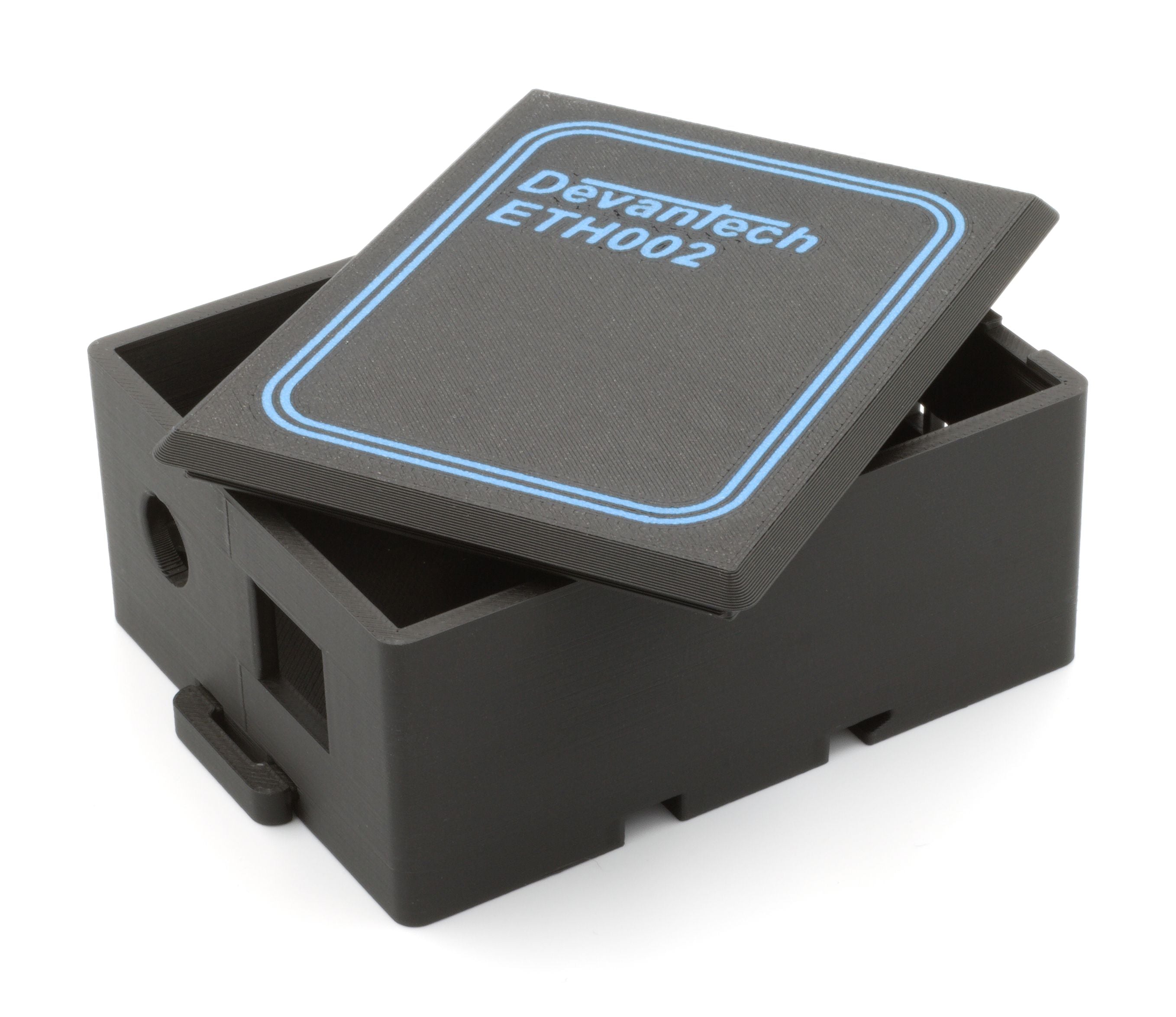 A black plastic case, partially open, labeled Devantech ETH002 Modul, is the ETH002C—designed for the ETH002 module.