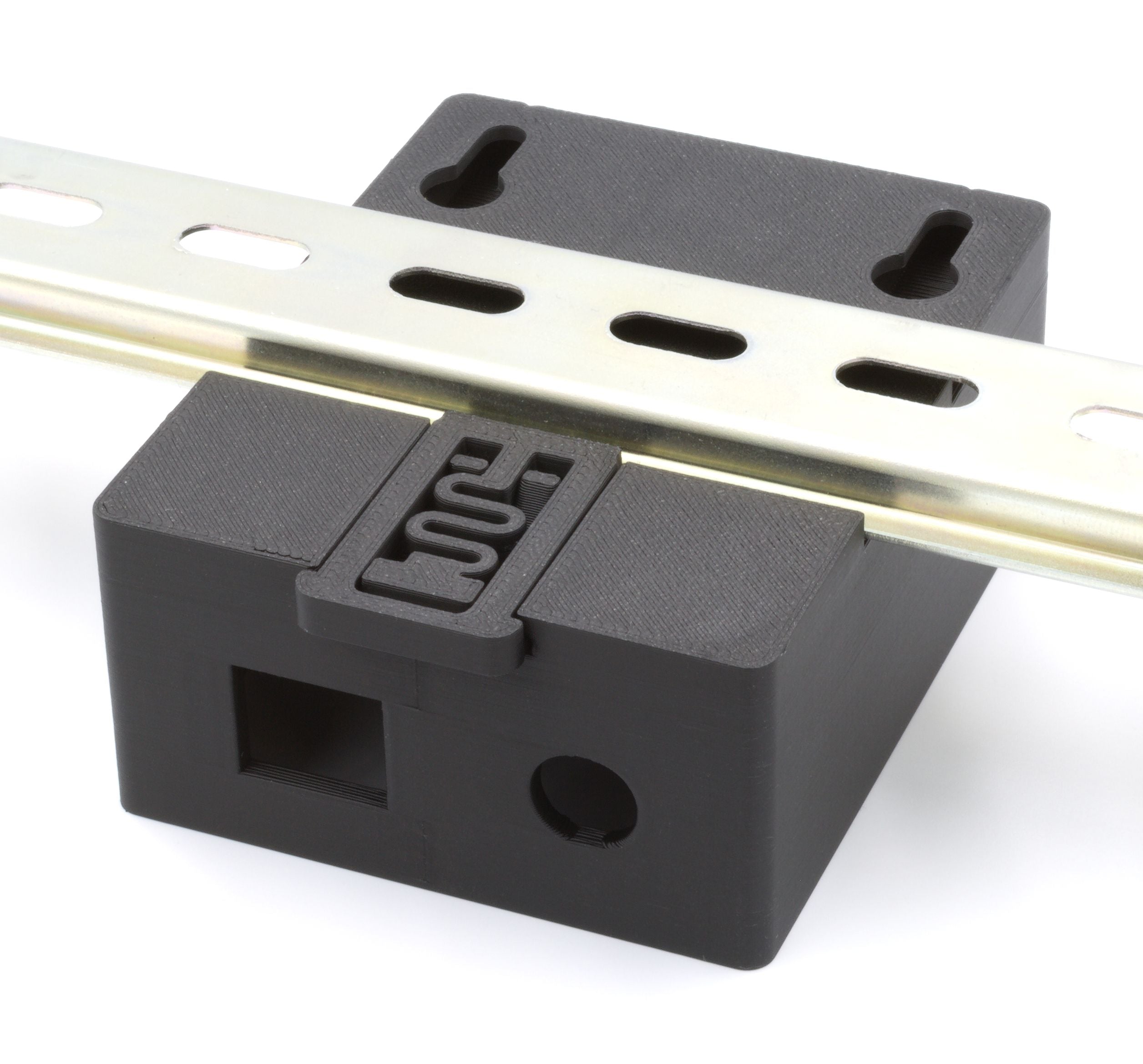 The ETH002C is a black plastic mounting block with slots and a metal rail on top, designed to securely house the ETH002 module or function as a relay enclosure.