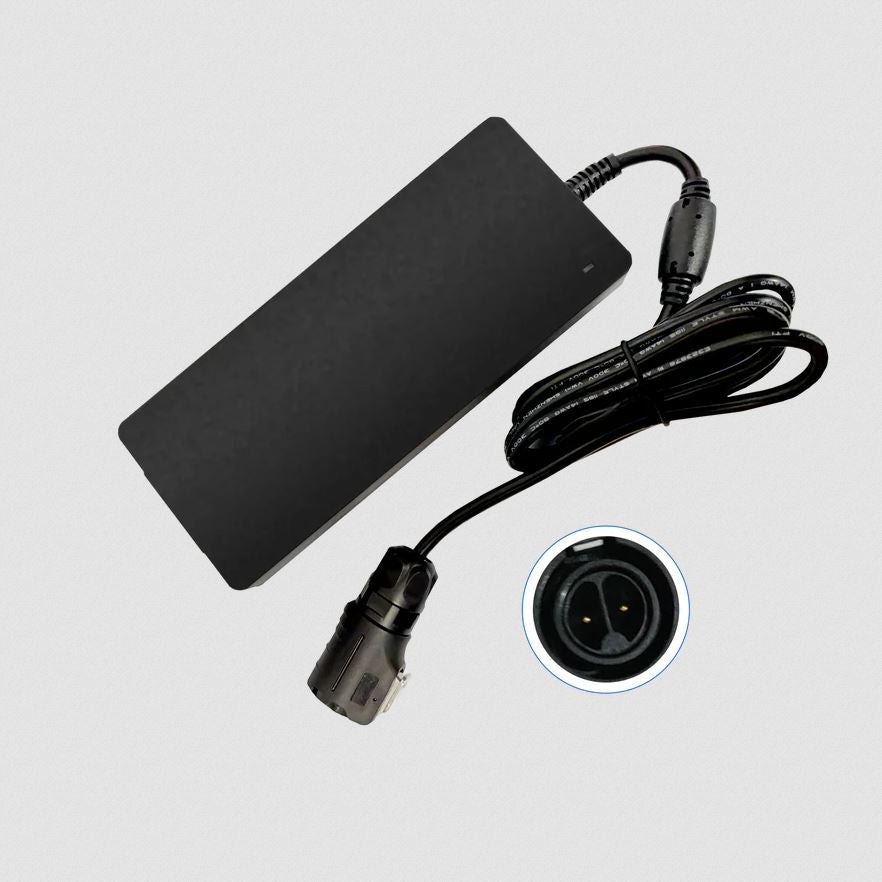 Black power adapter with cord and close-up of round two-pin connector on light background, ideal as a replacement Service-Netzadapter für RAK9155 Battery Plus.