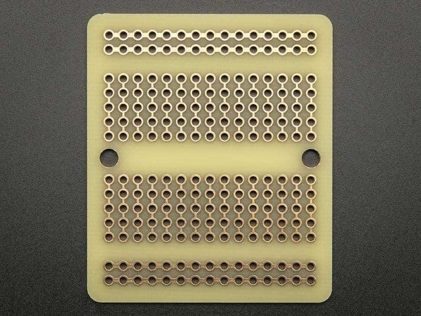 adafruit-perma-proto-quarter-sized-breadboard-pcb-3-pack-04_600x600.jpg